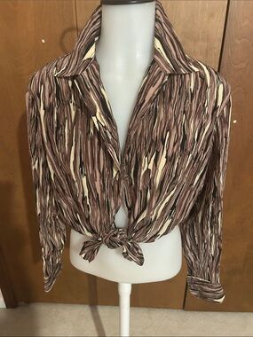 Women’s natural silk blouse with long sleeves.